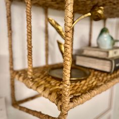 a wicker shelf with books on top of it