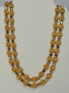 Alfred Philippe was Crown Trifari's Chief Designer from 1930 until 1968.  This exquisite necklace and earrings set was introduced during that time period and became referred to simply as the "Electra Collection".  The collection pieces utilized two innovative and striking types of beads.  The first type was the so called "Trifanium" spiked bead.  The second type was a gold plated crystal called an "Autrum" bead.  The intent of the Electra design was simply to "blow away" the competition--which i Formal Polished Round Bead Jewelry, Formal Double Strand Polished Beads Jewelry, Vintage 22k Gold Jewelry For Festive Occasions, Formal Round Polished Bead Jewelry, Vintage 22k Gold Hallmarked Jewelry, Vintage Yellow Gold Polished Bead Necklace, Vintage Yellow Gold Necklaces With Polished Beads, Vintage Yellow Gold Necklace With Polished Beads, Yellow Gold Hallmarked Costume Jewelry