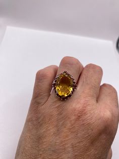 Unusual cut of citrine and surrounded by red garnets in golden 925 sterling silver setting Handmade Size 6.5 Can be resized, my jeweler charges $20 All rings are shipped in a nice gift box. Check out our over a THOUSAND great reviews!!! Engraving is $4 per letter and is not always perfect depending on the piece. It can take a few days if the jeweler is busy. This is payable to Paypal Judithsltd@gmail.com Yellow Multi-stone Rings For Formal Occasions, Formal Yellow Multi-stone Rings, Formal Yellow Multi-stone Jewelry, Oval Ruby Ring For Parties, Oval Ruby Ring For Party, Elegant Multi-stone Citrine Topaz Ring, Elegant Multi-stone Topaz And Citrine Ring, Multi-stone Citrine Gemstone Ring, Citrine Rings With Gemstone Accents For Gift