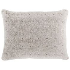 a white pillow with small stars on it