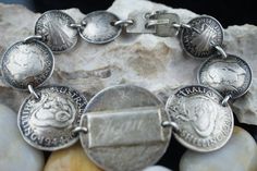 This is the perfect option for those who like cool, unique jewelry and the luxury, shine of silver. The bracelet is made of Australia coins that are linked together. The coins have different size. The middle has been engraved:New.... Gean Brother. The length of the bracelet is about 7.5 inches. The weight is 32g. The age is circa 1940s-1950s. ♥ There is no hallmark, but It is sterling 925(tested with acid). Everyone interested in the jewelry should remember that they must like their bracelet - n Anniversary Engraved Sterling Silver Bracelet, Antique Stamped 925 Bracelets For Anniversary, Antique Silver Engraved Bracelets For Anniversary, Antique Silver Engraved Jewelry For Collectors, Vintage Engraved Bracelets As Gift, Engraved Antique Silver Bracelets For Anniversary, Vintage Engraved Bracelets For Gift, Heirloom Silver Engraved Bracelets, Vintage Engraved Bracelet For Gift