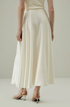 This exquisite 100% silk flowy maxi skirt is a testament to refined style and elegance. The sway of the fabric is mesmerizing, gracefully moving with your every step. The fluid sheen of the silk reflects light in a delicate, captivating manner. 100% silk Flowy maxi skirt Sway to mesmerize White skirt offers extra inner layer Fluid Sheen Silk Flowy Skirt, Maxi Silk Skirt, Maxi Skirt Silk, Silk Skirts, Flowy Maxi Skirt, Flowy Maxi Skirts, Lily White, Refined Style, White Skirt