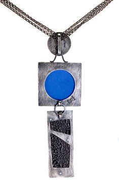 One of a kind textural necklace comprised of three vitreous enamel sections, one with fine silver grid set in sterling silver, the next a highly textured abstract also set in sterling, the last a layered enamel on waffled copper on sterling, all with patina, with black steel color chain that adjusts 17 - 20" with sterling hook clasp, enamel elements measure 5.25" long. Contemporary Blue Jewelry For Gifts, Contemporary Oxidized Jewelry For Gift, Contemporary Oxidized Finish Jewelry As Gift, Contemporary Oxidized Finish Jewelry For Gift, Modernist Enamel Jewelry For Gifts, Contemporary Blue Sterling Silver Jewelry, Modernist Enamel Jewelry Gift, Modern Handmade Enamel Jewelry, Modern Blue Jewelry With Unique Variations