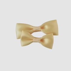 Dress to impress with our satin bow-tie! Available in 4 sizes, our bow-ties are perfect for newborns to men. With a wide range of 2024 fall and winter trending colors, they're perfect for weddings, holiday photoshoots, and any special occasion. Just slide clip over the top button and you are ready to go! • Satin ribbon• Bow-tie size • XS-0-6mos • Small 6mos.-4yrs. • Medium 4-12yrs • Large teen/adult• Handmade in the USA• Small women-owned business *Please note that bows are handcrafted and may vary slightly in size and look. Measurements are approximate. **NEVER leave children unattended or sleeping while wearing ANY hair accessories from Your Final Touch. Products may contain parts that can pose a choking hazard or strangulation. Pre-tied Decorative Bow For Gifts, Elegant Cream Bow For Parties, Elegant Cream Bow For Party, Pre-tied Bow With Bow Tie Back For Gifts, Elegant Solid Color Bow For Wedding, Satin Bow With Bow Tie Back For Gifts, Solid Color Bow Tie For Party, Classic Satin Bow For Gifts, Classic Satin Bow Tie As A Gift