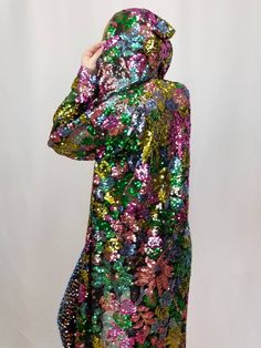 "This long sleeve sheer coat is so magical! The multi-colored floral patterned sequins glisten & shimmer in the sun. The mesh foundation creates a lacey shadow when light shines through it! It wears great from day to night and has a mesh foundation so it does not get too hot while you are dancing your heart out all day and night long. This gorgeous piece is made with a professional serger overlock stitch and hand sewn. I've always been inspired by nature, color, and human emotion. I make clo Sheer Coat, Mesh Robe, Plus Size Rave, Sequin Duster, Kimono Styles, Burning Men, Sequin Kimono, Bridal Kimono, Burning Man Costume