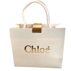 Beautiful White Chloe Shopping Bag With Gold Logo And Ribbon. (Medium Size) Size: 10” X 8.5” X 4” Ribbon 31” New Never Used. White Bags With Gold-tone Hardware For Gifts, White Bags With Gold-tone Hardware As A Gift, Chloe Bags, Bags Luxury, Chloe Bag, Gold Logo, Womens Tote Bags, Medium Size, Chloe