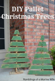 two wooden christmas trees sitting next to each other on top of a brick building with text overlay that reads diy pallet christmas trees