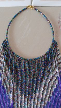 African beaded necklace, Multi-strand necklace, Fringe necklace, Masai necklace, Women jewelry, Christmas gift for her, Beaded jewelry An authentic elegant necklace that can match with any outfit. 100% handmade Closure: hook Color: multicolor Available in different colors of your taste. Neck width: 17 inches Fringe width 16 inches 3-5 days delivery via DHL Express The shipping fee is for the first item only and additional items ship for free. Feel free to send me a convo or e-mail for any clarif Multi-strand Beaded Necklaces For Party, Multi-strand Party Beaded Necklace With Dangling Beads, Party Multi-strand Beaded Necklace With Dangling Beads, Handmade Multi-strand Beads For Festive Occasions, Handmade Multi-strand Festive Beads, Handmade Multi-strand Bib Necklace For Party, Festive Handmade Multi-strand Beads, Handmade Multi-strand Costume Jewelry Beaded Necklaces, Multi-strand Colorful Beaded Necklaces For Festive Occasions