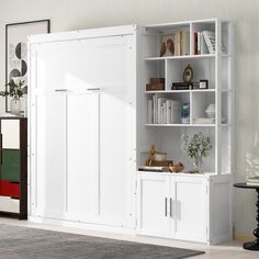 a white bookcase with doors and shelves in a living room