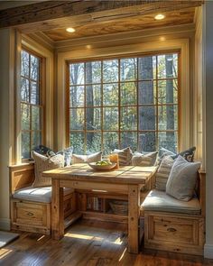 a wooden table sitting in front of a window