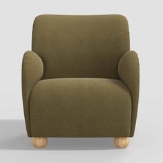 a green chair with wooden legs on a gray background, it appears to be an armchair