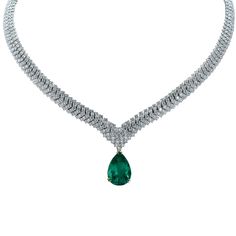 A magnificent 10.40ct rare Colombian Emerald, AGL certified, suspended from an elegant 18K white gold necklace containing 28.80cts of round brilliant cut diamonds F-G color and VS clarity. This vibrant emerald is removable making this breathtaking necklace extremely versatile. The necklace on its own is a statement piece, with row upon row of diamonds, set in a v-shape. The measurements of the inner side of the necklace is 16 inches and it is 8.9mm wide Our pieces are all accompanied by an appra Emerald And Diamond Necklace, Diamond Drop Necklace, Jewelry Design Drawing, White Gold Necklace, Diamond Necklace Set, Prom Jewelry, Diamond Jewelry Designs, Vintage Necklaces, Colombian Emeralds