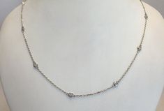 "10 brilliant, full cut, round diamonds, total weight .50 ct. F-G color, VS2-SI1 clarity This classic necklace is both timeless and elegant and will be sure to add that something special to any outfit, anytime! This stunning piece is made to order in your choice of 14kt white, yellow or rose gold, and comes on a high quality diamond cut cable chain in either 16\" or 18' inches. Please note that both lengths will contain only 10 diamonds. **Setting & Chain** 14kt gold, total weight 3.4 gram ( Anniversary White Gold Station Necklace With Bezel Setting, Anniversary Round Station Necklace With Single Cut Diamonds, Diamond Station Necklace With Single Cut Diamonds For Anniversary, White Gold Station Necklace With Diamond Accents For Anniversary, Anniversary Diamond Station Necklace With Bezel Setting, White Gold Diamond Station Necklace With Bezel Setting, Diamond Bezel Setting White Gold Station Necklace, Classic Yellow Gold Diamond Station Necklace, Yellow Gold Diamond-shaped Necklace With Single Cut Diamonds