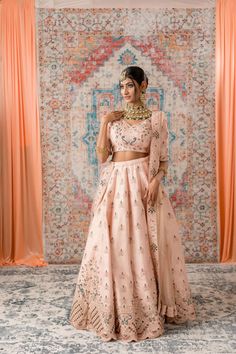 Pastel Pink Color Thread and Mirror Work Lehenga Peach Lehenga With Traditional Drape For Reception, Peach Choli With Sheer Dupatta For Weddings, Bollywood Style Peach Lehenga For Wedding, Traditional Drape Peach Lehenga For Reception, Peach Floor-length Lehenga For Wedding, Peach Lehenga For Wedding And Diwali, Peach Unstitched Blouse For Wedding, Peach Traditional Wear With Unstitched Blouse For Wedding, Peach Lehenga With Unstitched Blouse For Wedding