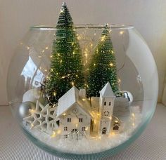 a snow globe with christmas trees in it