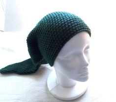 Video game Hat, Dark Green elf Hat gamer Outfit piece, crocheted cosplay Hat, elf Cap,  This piece is great for cosplay, conventions, ren fairs, Halloween, or Taco Tuesdays.  Hat Measures 12 inches diameter / and around 22 inch circumference  on the crown and 25 inches long.  Made with 100% very soft acrylic yarn so it's easy to clean, and falls below one's shoulders (for most people).  The color is a forest green and would look great for any woodland themed or game character event.  The size is best suited/meant for adults, but with the brim rolled up this will fit older kids and teens as well.  Care Instructions - suitable for machine wash and dry; but i recommend air drying to keeping it look just like new.  Looking for more hats? :  https://www.etsy.com/shop/TickledTwist?ref=l2-shophea Elf Cap, Gamer Outfit, Green Video, Hat Cosplay, Link Cosplay, Elf Hat, Gaming Clothes, Crochet Videos, Silver Spring