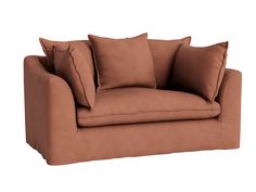 a brown couch with several pillows on it's back and one arm facing the camera