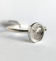 a close up of a ring on a white surface