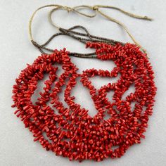 A long Santa Domingo 3 strand red coral and fine shell necklace. Guessing 1980's or 1990's. I've had them for awhile. 21 inches of coral times 3 strands shell is 6 inches. 8" braided cord on each side So - total length 45" at the max. 34" min. Red Hand-strung Multi-strand Jewelry, Handmade Multi-strand Red Coral Jewelry, Red Multi-strand Necklaces With Natural Stones, Red Multi-strand Hand-strung Necklace, Handmade Multi-strand Red Coral Necklace, Red Multi-strand Coral Beaded Necklaces, Multi-strand Red Coral Beaded Necklace As Gift, Multi-strand Red Coral Beaded Necklace For Gift, Red Coral Double Strand Necklace