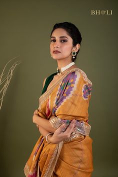 This exquisite handloom tussar silk saree features intricate gota and pearl work, handcrafted with precision and care. The digitally printed design adds a modern touch to this traditional piece, while the soft and flowy fabric ensures comfort and elegance. The perfect choice for those seeking a smart and contemporary saree. Traditional Tussar Silk Wear With Gota Work, Festive Bohemian Pre-draped Tussar Silk Saree, Multicolor Dola Silk Pre-draped Saree With Motifs, Tussar Silk Traditional Wear With Gota Work For Puja, Tussar Silk Dupatta With Gota Work, Navratri Silk Saree With Gota Work, Festive Silk Saree With Gota Work, Diwali Tussar Silk Dupatta With Gota Work, Diwali Tussar Silk Traditional Wear With Gota Work