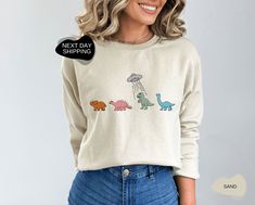 "Funny Sweater, Dinosaur Sweatshirt, Dinosaur Sweater, Dino Sweatshirt, Retro Dinosaur Sweatshirt, Retro Dinosaur Sweatshirt, Dinosaur, Hoodies and Sweaters 📣 Please check all photos for details. 📣 Use \"Add message to Seller\" link on the checkout page to send a message or important details for your order. 📣 We use Bella Canvas and Gildan when we have a shortage of stocks. 📣 Our printing method is Decal Printing, Premium Vinyl and Heat Press. 📣 How Do I Order? - Please check all size chart Long Sleeve Cotton Tops With Dinosaur Print, Long Sleeve Cotton Top With Dinosaur Print, Cotton Long Sleeve Tops With Dinosaur Print, Unisex Dinosaur Print Crew Neck Top, Casual Dinosaur Print Tops For Fall, Casual Cotton Sweatshirt With Dinosaur Print, Long Sleeve Top With Dinosaur Print For Fall, Cotton Tops With Dinosaur Print For Fall, Cotton Top With Dinosaur Print For Fall