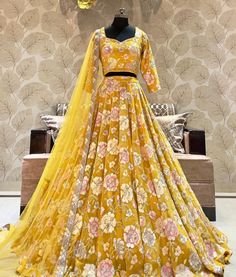 Made to Order/Measurement/Custom Order Lehenga - Color : Yellow - Fabric : Embroidered Georgette  - Fully flared paneled lehenga -   Attached  Dupatta with Blouse - Drawstring closure with Tassels - - It can be customize in any design or size  PLEASE NOTE: BUYERS ARE RESPONSIBLE FOR ANY CUSTOMS AND IMPORT TAXES THAT MAY APPLY. This is a made to order product. If you opt for 'Made To Measurement Option', we will provide a measurement template and you can share the measurements likewise. If you want to opt for 'Standard Size', Please refer to the size chart provided in the listing. Shipping: Standard Shipping is done by DHL ecommerce and it mostly takes 2 to 3 weeks to deliver after dispatch. Express Shipping is done by DHL express and it mostly delivers within a week after dispatch. Fabric Yellow Semi-stitched Sets For Navratri, Fitted Yellow Art Silk Embroidered Fabric, Fitted Yellow Embroidered Art Silk Fabric, Traditional Designer Yellow Anarkali Set, Traditional Yellow Anarkali Set For Designer Wear, Reception Yellow Sharara With Intricate Embroidery, Yellow Traditional Anarkali Set For Designer Wear, Yellow Art Silk Embroidered Fabric For Reception, Yellow Art Silk Floor-length Dupatta