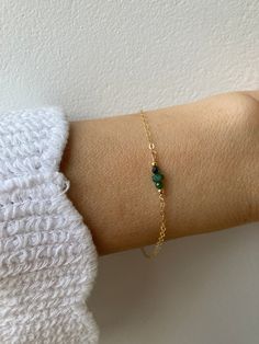 This little bracelet made with high quality materials makes a great gift. Emerald is also the birthstone of anyone born in the month of May. D E T A I L S  *It features high quality emerald rondelles  They are very nicely cut for maximum sparkle. *Choose between a 14k gold filled/rose gold filled chain or sterling silver chain. *Gold filled is a wonderful alternative to solid gold and unlike gold plating does not rub off. *It closes with a hallmarked spring clasp measuring 6mm. *Bracelet comes care instructions and a matching crystal information card and is ready for gifting. S I Z I N G * H E L P Choose the length from the drop down menu. Use the length guide as a reference. If unsure choose the extender option which will allow room for adjustment. C A R E * T I P Your  bracelet is dainty Emerald Bracelet Simple, Green Emerald Bracelet, Crystal Information, Month Of May, Emerald Bracelet, Bracelet Simple, Information Card, May Birthstone, Chain Gold