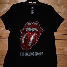 At This Time, I Am Not Accepting Offers For Any Of My Rolling Stones Shirts As I Have Very Limited Supplies. Custom Made To Order Rolling Stones Rhinestone Bling Shirt Black Short Sleeved Vneck Shirt Available As A Round Neck In My Other Listing. This Shirt Features A Large Stones Design With 1000's Of Sparkling Very Colorful Rhinestones. Great Concert Shirt Or Just A Great Way To Celebrate The Amazing Rolling Stones. Shirts Used Are First Quality Retail Shirts That Run True To Size. They Do Not Black V-neck Tops With Rhinestones, Black V-neck Top With Rhinestones, Fitted V-neck Top With Rhinestones, Casual Sequined V-neck Top, Casual V-neck Sequined Tops, Rolling Stones Shirt, Bling Shirt, Rhinestone Shirt, Rhinestone Projects