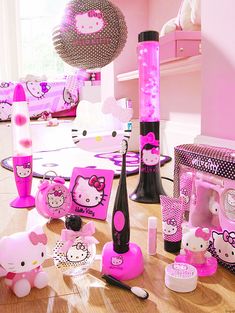 hello kitty themed party supplies on display in a room with pink walls and flooring