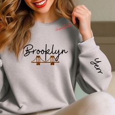 Brooklyn women are just made different. Rep your borough with this sweater perfect for fall.  These garments are made from polyester and cotton. This combination helps designs come out looking fresh and beautiful. The collar is ribbed knit, so it retains its shape even after washing. There are no itchy side seams on these sweaters.  .: Made with a medium-heavy fabric blend of 50% cotton and 50% polyester (8.0 oz/yd² (271.25 g/m this sweatshirt feels cozy and is the perfect choice for those colder months. .: The classic fit along with the crew neckline deliver a comfy wearing experience with a clean-cut style. Meanwhile, the double-needle stitching at the shoulder, armhole, neck, waistband, and cuff seams add top-tier durability.  .: Say goodbye to itchiness thanks to the gray, pearlized te Womens Crewneck, Heavy Fabric, Cut And Style, Crewneck Sweatshirt, Sweat Shirt, Ribbed Knit, Brooklyn, Crew Neck Sweatshirt, Bathing Beauties