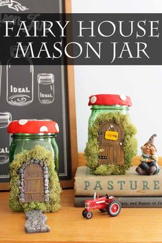 fairy house mason jars are sitting on a table