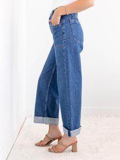 We are loving the denim updates that we are seeing this season and these new arrivals from Free People show off some of our favorite details all in one. The unique button waist detail adds a unique and casual twist on a traditional waistband. A wider leg silhouette features a cuffed accent that can be uncuffed for versatility, allowing this look to be styled in a variety of ways this season. Free People Wider leg silhouette Cuffed hemline Unique button waist accent 100% Cotton Rise: 10.5" Inseam: 26" cuffed | 31" uncuffed.. Leg opening: 17" Spring Utility Wide Leg Flare Jeans, Versatile Dark Wash Flare Jeans With Pockets, Versatile Dark Wash Flare Jeans, Versatile Dark Wash Flare Jeans For Everyday, Versatile Denim Bottoms For Fall, Versatile Wide-leg Cropped Denim Jeans, Everyday Spring High Rise Cargo Jeans, High Rise Cargo Jeans For Everyday Spring Wear, Everyday High Rise Cargo Jeans For Spring