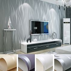 a modern living room with white furniture and wallpaper on the walls, including a flat screen tv