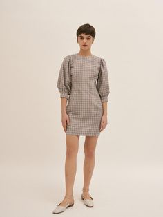 Editor's NotesBLUV's effortlessly girlish and feminine aesthetic is showcased with check dress- Check dress with volume sleeves- Crafted from seer sucker cotton blend fabric - Volume sleeves - Slightly fitted waist line- Back zip closure- Lovely mood - Good to wear as summer point dressMeasurement (inch)- Shoulder: 13.4in- Chest:25.2in- Sleeve: 15.5in- Length: 31.7n* Model info: Height 5'5 Chest 31' Waist 23' Hip 35'Composition & Care- 40 % Cotton 60 % Polyester- Dry Fitted Plaid Puff Sleeve Dress, Spring Plaid Puff Sleeve Dress, Chic Plaid Puff Sleeve Dress, Seer Sucker, Volume Sleeves, Check Dress, Feminine Aesthetic, Cotton Blend, Fabric