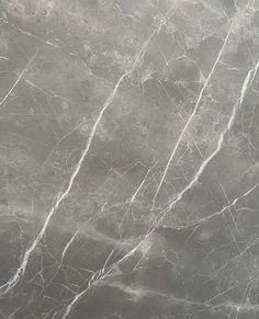 a gray marble textured surface with white lines