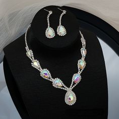 [Material]: copper melon chain rhinestone crystal [Size]]: The total circumference of the necklace is about 45cm, of which the extension chain is about 9.0cm Pendant length: about 3.5cm Earring size: 4.5cm * 1.3cm Sizing Questions? We RECOMMEND getting a size bigger than your usual size for best fitting! Orders are processed within 8-14 business days. (Monday through Friday) No refunds or exchanges! ALL SALES ARE FINAL! Questions? Fill out contact form or contact us @megabombblvd@gmail.com Crystal Pendant Jewelry Set For Party, Party Crystal Pendant Jewelry Sets, Multicolor Crystal Chain Jewelry, Multicolor Crystal Jewelry With Chain, Multicolor Teardrop Crystal Jewelry, Crystal Rhinestone Necklace With Adjustable Chain, Multicolor Crystal Teardrop Jewelry, Teardrop Crystal Jewelry With Adjustable Chain, Crystal Teardrop Jewelry With Adjustable Chain