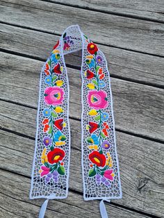 Dress up any outfit in your wardrobe with beautiful embroidered accessories! Add interest to a casual outfit with a beautiful belt. Embroidered by hand in Hungary, Kalocsa city.  This is an unique handmade work. This is a perfect gift for friends and for your family. Original Kalocsa work! lenght , 34" width , 2,5" If you are buying several pieces I can combine postage at the time of mailing. If you have any question please don't hesitate to contact me For vintage Hungarian emboridery please vis Handmade Bohemian Belt With Multicolor Embroidery, Bohemian Embroidered Belt For Spring, Bohemian Multicolor Belts For Spring, Festival Fabric Belt With Multicolor Embroidery, Festival Multicolor Embroidery Fabric Belt, Handmade Multicolor Belt For Festivals, Handmade Multicolor Belts For Festival, Multicolor Embroidered Fabric Belt For Festival, Spring Festival Fabric Belt