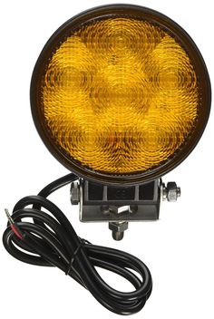 an image of a yellow light that is on the side of a white background with wires