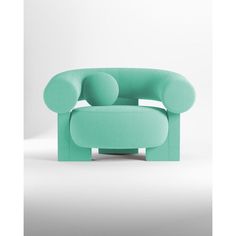 a green chair sitting on top of a white floor