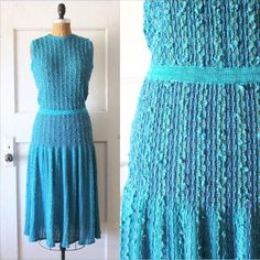 Beautiful vintage 1980s electric blue knit dress with multicolor threads and fiber. This beauty has a slight drop waist with light elastic. Featuring a rounded neckline with keyhole cutout in the back, sleeveless shoulders, slight drop waist, and flared skirt. The top portion is unlined. The skirt is lined in a light blue slinky nylon type material. Made of soft acrylic knit, has a coolness to the touch. Breathable enough to wear in the summer. No closures other than the button at the back of th Vintage Drop Waist Dress, Blue Knit Dress, Drop Waist Dress, 1960's Dress, Fabric Labels, 80s Dress, Dropwaist Dress, 1920s Fashion, Rounded Neckline