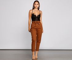 Keep on trend with tapered pants that are perfect to take you from day to night! The pants feature a high rise paperbag waist. a tie-waist belt. a double row slide hook closure. hidden zipper. slant pockets. faux back pockets. and a tapered leg. The pants are composed of a twill knit fabric that offers a form hugging fit with minimal stretch. Complete look with a bodysuit and mules.Fit & Features High rise paperbag waist Removable tie-waist belt. belt loops Double-row metal slide hook closure. h Paperbag Pants, Metal Slide, Tapered Pants, Keep On, Trendy Dresses, Waist Belt, Tapered Legs, Fashion Pants, Knit Fabric