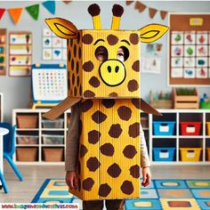 a young child wearing a cardboard box shaped like a giraffe