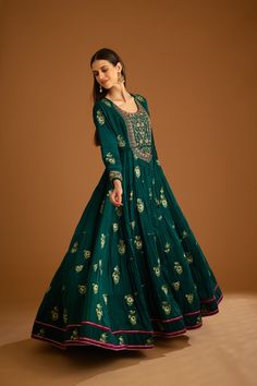 Editor's Note Featuring a zardozi embroidered brocade anarkali with flat chiffon dupatta and trousers Color: Bottle green Fabric: Viscose brocade, cotton satin, flat chiffon Embroidery details: Applique, gota and thread embroidery Anarkali length: 57", trouser length: 38" Components: Anarkali, trouser & dupatta Occasion: Festive Care: Dry clean only About the Designer Shyam Narayan Prasad started his journey in the Indian Fashion Design Industry with a couture women’s wear collection. The design Floor-length Anarkali Set With Intricate Embroidery For Festivals, Maxi Length Salwar Kameez With Intricate Embroidery For Navratri, Green Maxi Length Lehenga With Intricate Embroidery, Anarkali Salwar Kameez With Intricate Embroidery For Diwali, Green Anarkali Set With Intricate Embroidery For Diwali, Green Anarkali Set With Intricate Embroidery For Festive Occasions, Festive Green Anarkali Set With Intricate Embroidery, Green Embroidered Anarkali Set For Festivals, Green Art Silk Anarkali Set With Intricate Embroidery