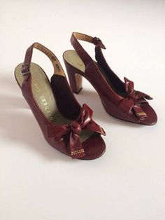 "Immaculate late 1940s Herbert Levine slingback leather pump heels in crimson red featuring big gold studded bows and suede lining, originally sold by Shoe Salon, Marshall Field & Company Chicago. Winner of two Coty awards, Levine was an innovator of women's footwear from the late 1940s to the mid 1970s. Alongside his wife (the designer), Levine introduced styles to the fashion world such as Spring-O-Lator mules, 'Kabuki' pumps and stocking boots. This is an amazing early example of their wo Vintage Burgundy Heels For Formal Occasions, Vintage Leather Slingback Pumps For Formal Occasions, Vintage Slingback Pumps For Formal Occasions, Vintage Slingback Pumps With Pointed Toe, Vintage Leather High Heel Slingback Pumps, Vintage High Heel Slingback Pumps For Evening, Vintage Slingback Pumps With Round Toe For Formal Events, Vintage Slingback Pumps With Round Toe For Formal Occasions, Vintage Round Toe Slingback Pumps For Formal Events