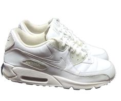 Introducing the Nike Air Max 90 in a timeless and classic white leather design, perfect for any sneaker enthusiast. This shoe features a low top shaft style with a US shoe size of 12, making it ideal for men who love a comfortable and stylish pair of athletic shoes. The color is a bright white that complements the vintage design, with the iconic Nike brand displayed proudly on the side. This sneaker is perfect for running and jogging, with a performance and activity level that is sure to impress even the most dedicated athletes. The Nike Air Max 90 is part of the Nike Air Max product line, a well-known and respected brand in the world of athletic shoes. With a release year of 2014, this shoe is perfect for collectors and casual wearers alike. Don't miss out on this amazing opportunity to a Nike Air Max 90 White, Nike Brand, Nike Air Max 90, Leather Design, Classic White, Vintage Design, White Leather, Bright White, Low Top