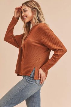 The Carole Sweater features a slouchy, oversized fit with a ribbed knit top for and lace-up detailing at the henley neckline. Style: Casual Print / Pattern: Rib Knit Fit: Oversized Neck Line: Henley Sleeve: Long Sleeve Closure: Lace-up Made In: Imported Fabric Contents: 96% Polyester 4% Spandex Non-sheer fabric Size Measurement (inch): S: 20.0 (Bust), 21.0 (Waist), 21.0 (Hips), 22.0 (Length) M: 20.5 (Bust), 21.5 (Waist), 21.5 (Hips), 22.5 (Length) L: 21.0 (Bust), 22.0 (Waist), 22.0 (Hips), 23.0 Everyday Fall Waffle Knit Top, Casual Waffle Knit Henley For Fall, Everyday Fall Waffle Knit Henley, Fall Everyday Waffle Knit Henley, Fall Waffle Knit Henley For Everyday Wear, Everyday Fall Henley, Casual Ribbed Henley For Fall, Henley Neckline Waffle Knit Tops For Fall, Ribbed Henley For Fall