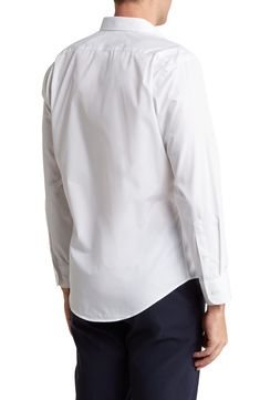 A smooth cotton-blend forms an easy-care dress shirt featuring a sharp button-down collar and rounded, single-button cuffs. Raised placket Button-down collar Rounded, one-button cuffs 55% cotton, 45% polyester Machine wash, tumble dry Made in Turkey Classic Button-up Shirt With Back Button Closure, Classic Button-up Dress Shirt For Spring, Classic Spring Button-up Dress Shirt, Slim Fit Button-up Shirt With Button Closure, Business Casual Button-up Dress Shirt With Placket, Classic Fitted Shirt With Back Button Closure, Classic Long Sleeve Shirt With Back Button Closure, Solid Color Button-up Dress Shirt, Tailored Button-up Shirt