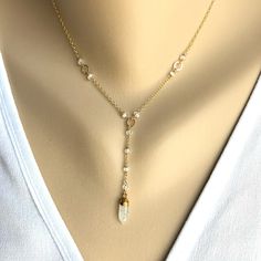 "Simple and dainty short Y necklace. It can be worn alone or layered with other necklaces. This design is available only in 14K Gold Filled finish. The necklace has a 2\" extension and it's available in different lengths. From left to right : a) Moonstone drop and Moonstone rondelles b) Rutilated Drop and Rutilated rondelles c) Black Onyx Drop and Black Onyx rondelles" Delicate Adjustable Crystal Necklace With Delicate Chain, Adjustable Delicate Crystal Necklace With Delicate Chain, Adjustable Delicate Crystal Necklace, Delicate Crystal Necklace With Adjustable Chain, Delicate Adjustable Crystal Necklaces, Minimalist Wire Wrapped Crystal Necklaces, Minimalist Wire Wrapped Crystal Necklace, Dainty Adjustable Dangle Crystal Necklaces, Dainty Adjustable Dangle Crystal Necklace