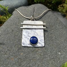 "Sterling silver with a 6mm gemstone of your choice. This stunning hand-hammered pendant is 13/16\" in width by 1\" in length. A perfect complement to the Asian Flair Earrings on the earrings page. When checking out please specify if you would like a 16\" or 18\" sterling silver chain." Silver Hammered Rectangular Pendant Jewelry, Hammered Sterling Silver Rectangular Pendant Jewelry, Sterling Silver Hammered Rectangular Pendant Jewelry, Hammered Sterling Silver Jewelry With Rectangular Pendant, Hammered Rectangular Sterling Silver Jewelry, Hammered Sterling Silver Jewelry In Rectangular Shape, Rectangular Hammered Sterling Silver Jewelry, Sterling Silver Rectangular Pendant With Polished Finish, Hand Forged Square Pendant In Sterling Silver