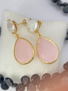 "Beautiful Rose quartz Dangle drop gemstone earring made with 18k Gold Plated Brass. These handmade earrings are an easy-to-wear size, and they are definitely eye-catching. Great gift for daughters, sisters, bridesmaids and more. Just as the color may suggest, this pink stone is all about love. It's said to help restore trust and harmony in all different kinds of relationships while improving their close connections. It's also claimed to help provide comfort and calm during times of grief. It isn't all about other people, though. Rose quartz is said to also encourage love, respect, trust, and worth within one's self -- something we could all use in this day and age. Makes a perfect gift for your girlfriend, wife, mom or simply an excellent addition to your jewelry collection. Variation and Pink Dangle Teardrop Earrings For Gift, Pink Pearl Drop Teardrop Earrings, Feminine Teardrop Earrings As Gift, Feminine Teardrop Earrings For Gifts, Pink Teardrop Pearl Drop Earrings, Pink Bridal Earrings As Gift, Feminine Bridal Drop Earrings As Gift, Feminine Bridal Drop Earrings For Gifts, Pink Teardrop Earrings For Gift